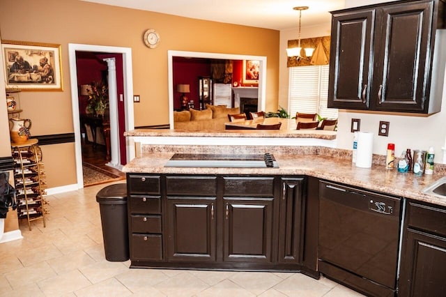 kitchen with dark brown cabinetry, a chandelier, hanging light fixtures, and black appliances