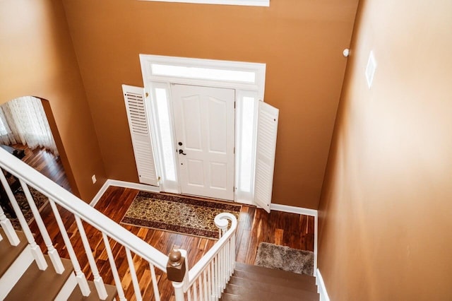 entrance foyer with dark hardwood / wood-style floors