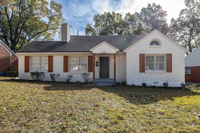 ranch-style house featuring a front lawn