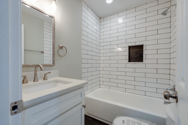 bathroom featuring vanity and tiled shower / bath combo