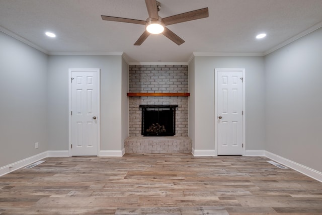 unfurnished living room with a fireplace, light hardwood / wood-style flooring, ceiling fan, and crown molding