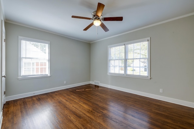 unfurnished room featuring ornamental molding, dark hardwood / wood-style floors, ceiling fan, and a healthy amount of sunlight