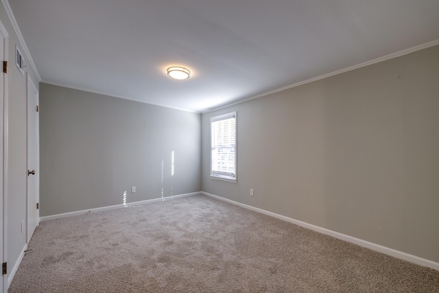 carpeted spare room with crown molding