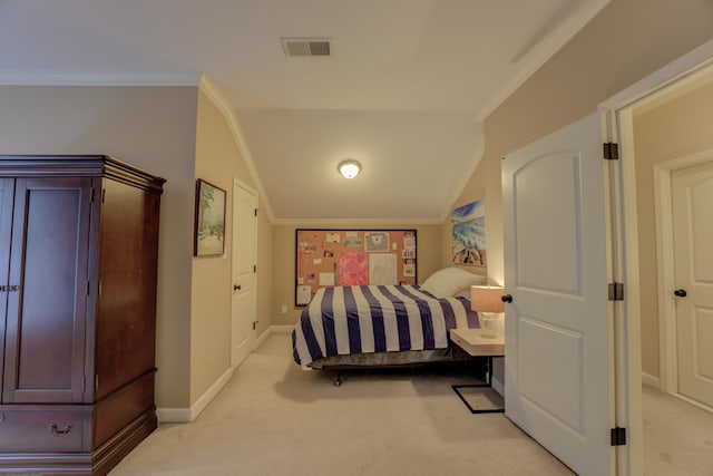 carpeted bedroom featuring crown molding and vaulted ceiling