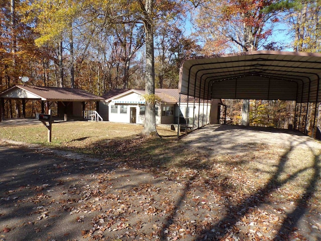 view of side of home featuring a carport