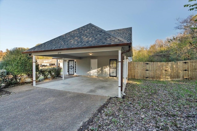 exterior space with a carport