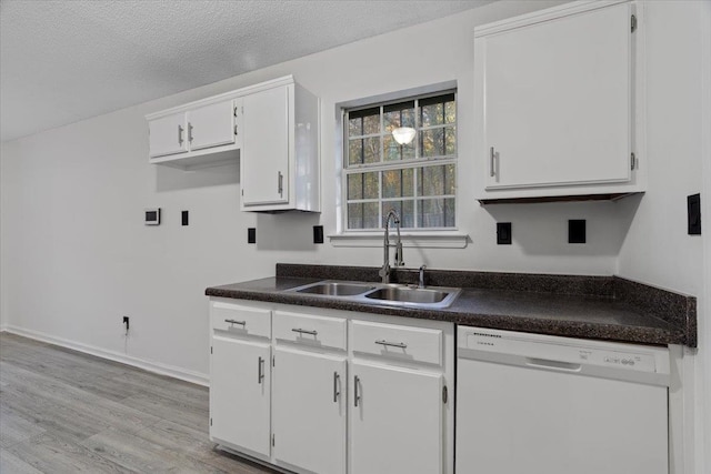 kitchen with dishwasher, sink, light hardwood / wood-style flooring, a textured ceiling, and white cabinetry