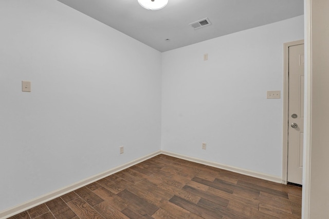 empty room featuring dark hardwood / wood-style floors