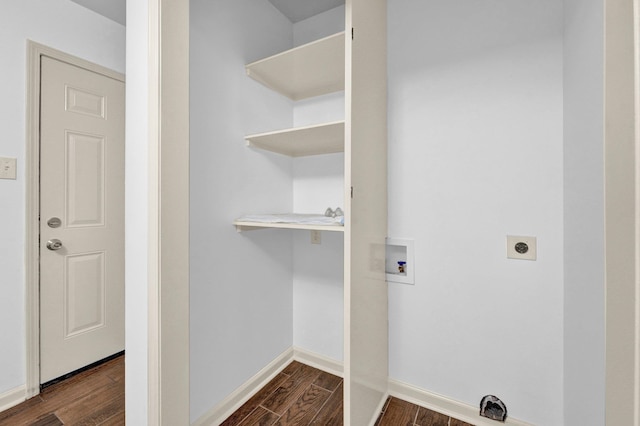 laundry area featuring electric dryer hookup, dark hardwood / wood-style flooring, and washer hookup