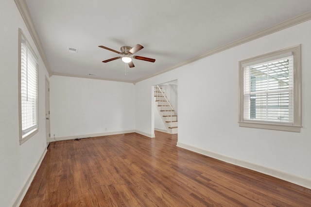 empty room with wood-type flooring, ceiling fan, and crown molding