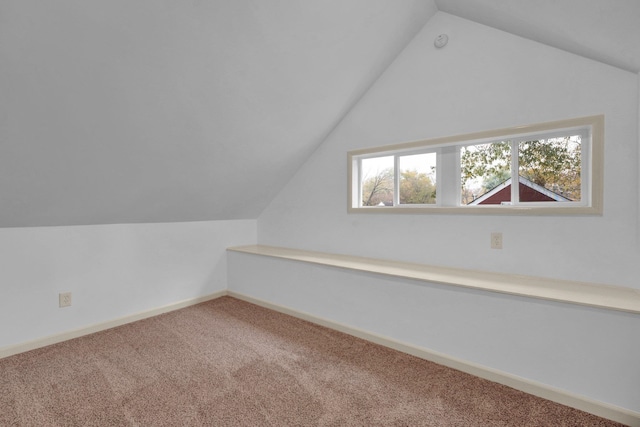 bonus room featuring carpet flooring and vaulted ceiling