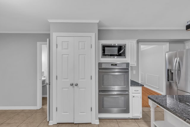 kitchen featuring stainless steel appliances, white cabinetry, and crown molding