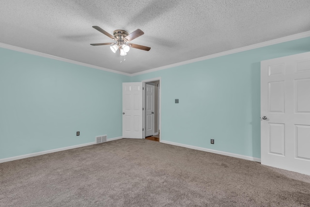 carpeted spare room featuring a textured ceiling, ceiling fan, and ornamental molding