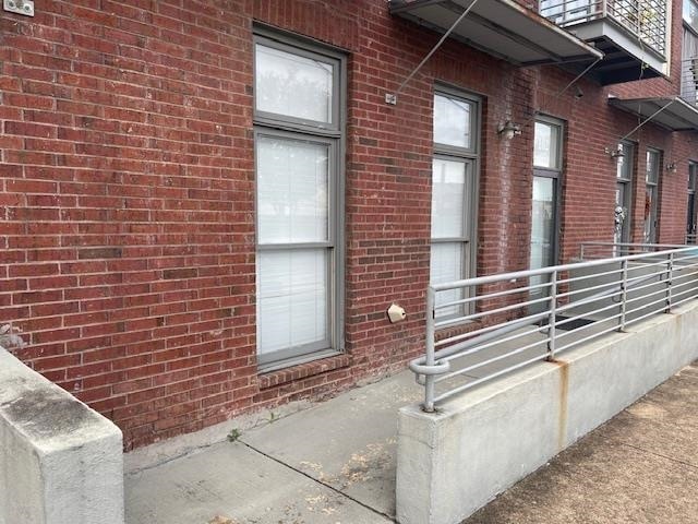 view of side of property with brick siding