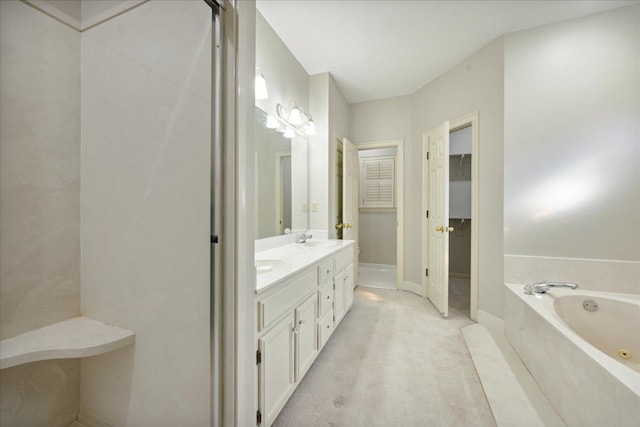 bathroom featuring vanity and a tub to relax in