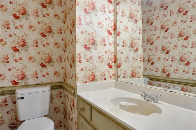 bathroom featuring vanity and toilet