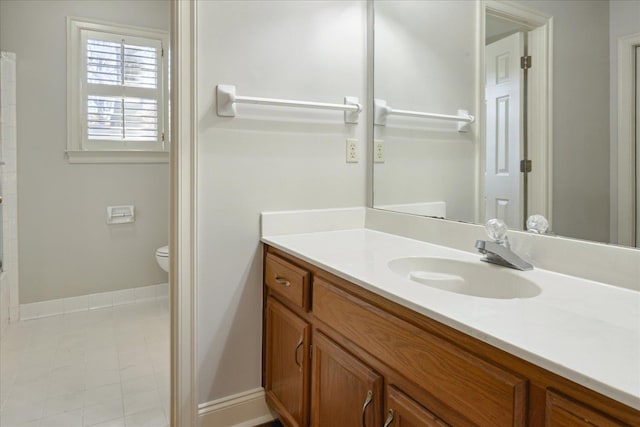 bathroom with vanity, toilet, and walk in shower