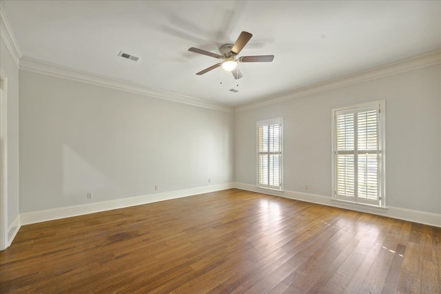 spare room with dark hardwood / wood-style flooring, ceiling fan, and crown molding