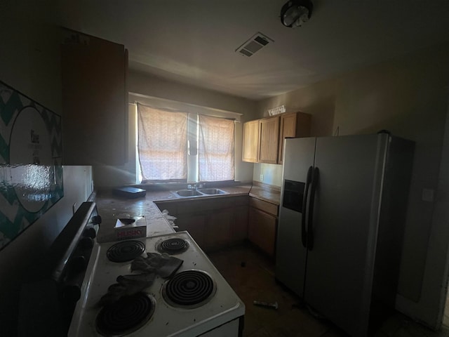 kitchen with white range with electric stovetop, stainless steel fridge with ice dispenser, and sink