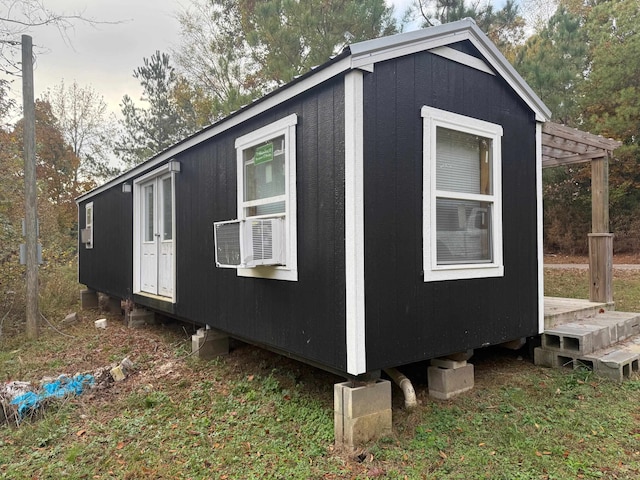 view of outbuilding featuring cooling unit