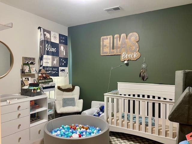 bedroom with a nursery area