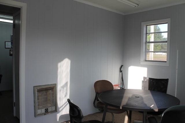 office area featuring crown molding, wooden walls, and heating unit