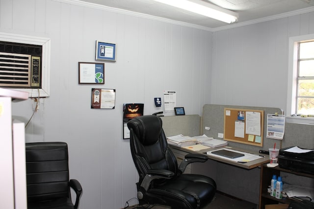 office space with ornamental molding and wood walls