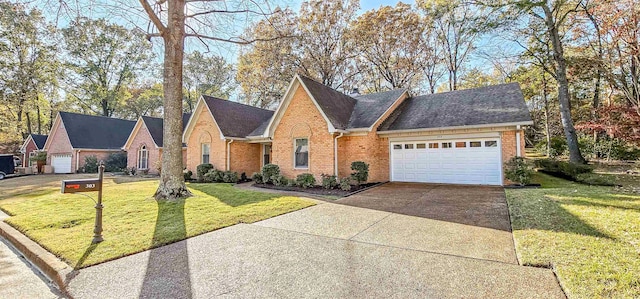 view of front of home featuring a front yard and a garage