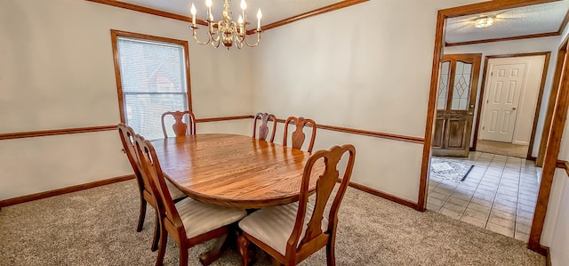 carpeted dining space with a chandelier and ornamental molding