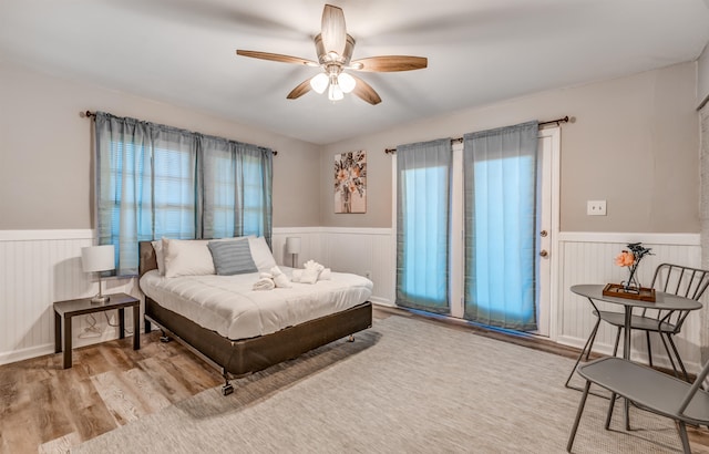 bedroom featuring ceiling fan and light wood-type flooring