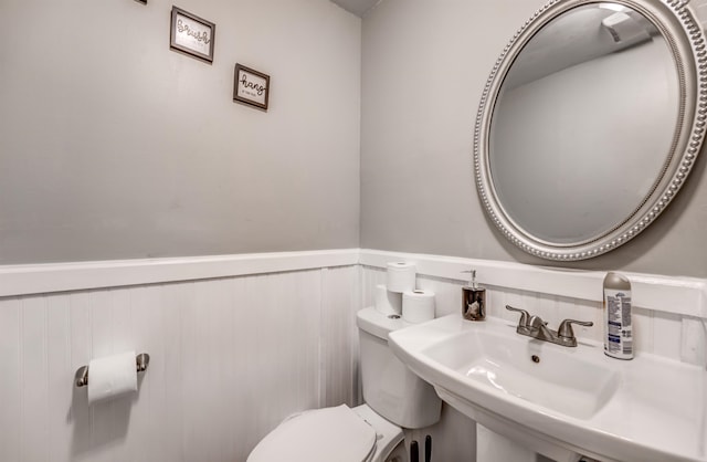 bathroom featuring sink and toilet