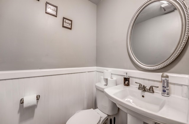 4493 Quince Rd, Memphis, TN 38117 - half bathroom with a wainscoted wall and toilet