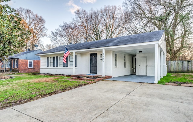 4493 Quince Rd, Memphis, TN 38117 - ranch-style house with brick siding, driveway, an attached carport, and a shingled roof
