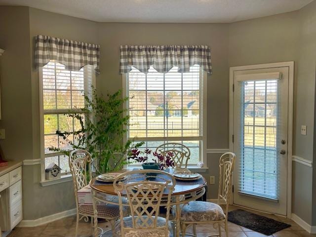 dining room featuring light tile patterned flooring