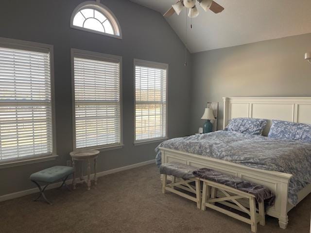 bedroom featuring ceiling fan, dark carpet, and lofted ceiling