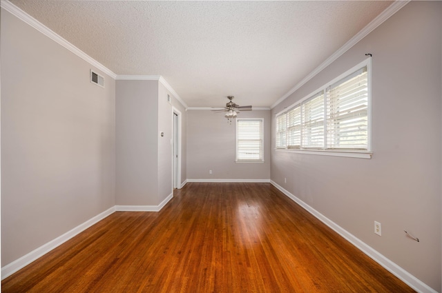 empty room with hardwood / wood-style floors, ceiling fan, ornamental molding, and a textured ceiling