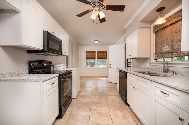 kitchen featuring ornamental molding, a textured ceiling, sink, black appliances, and white cabinetry