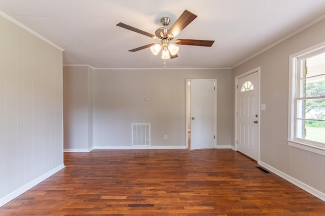 entrance foyer with dark hardwood / wood-style floors, ceiling fan, and ornamental molding