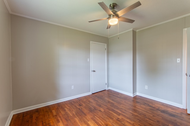 unfurnished room with ceiling fan, dark hardwood / wood-style flooring, and crown molding