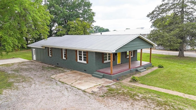 view of front of home with a porch and a front yard