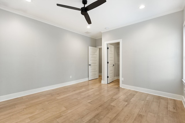 unfurnished bedroom featuring light hardwood / wood-style floors, ceiling fan, and crown molding