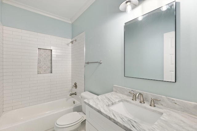 full bathroom with vanity, toilet, crown molding, and tiled shower / bath