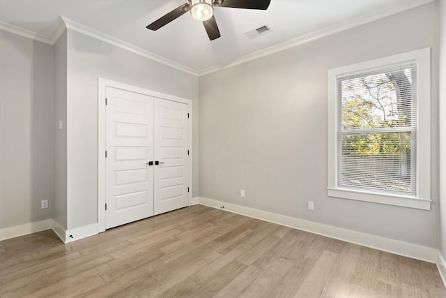 unfurnished bedroom with ceiling fan, light hardwood / wood-style flooring, and ornamental molding