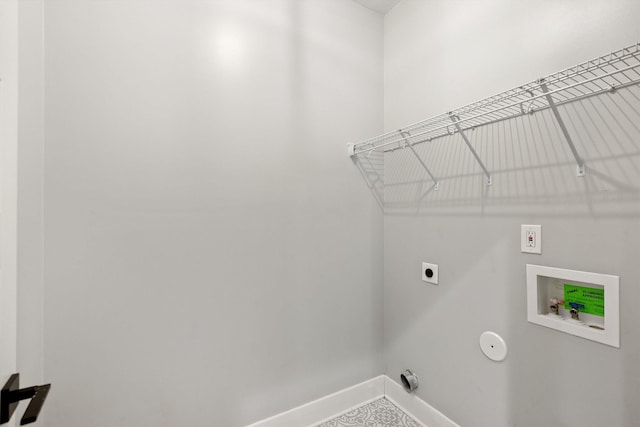 washroom with hookup for an electric dryer and hookup for a washing machine