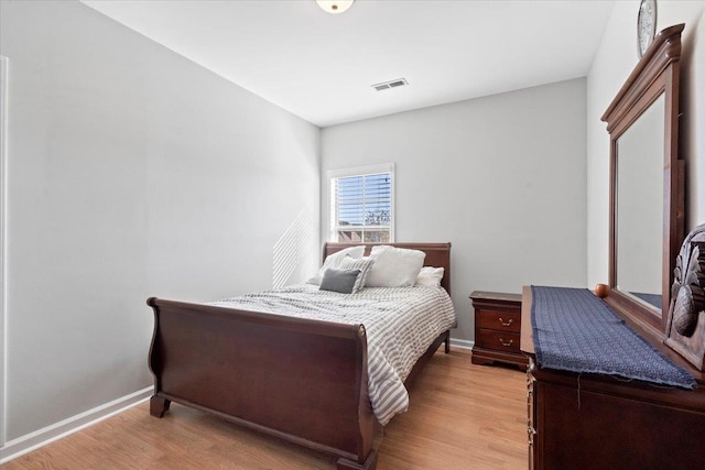 bedroom with light hardwood / wood-style flooring