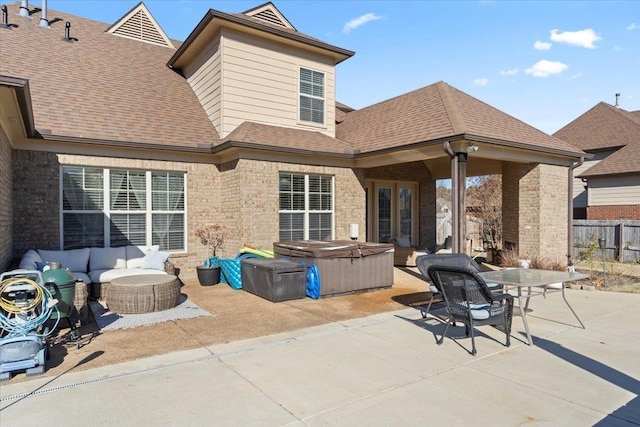 view of patio with an outdoor hangout area and a hot tub