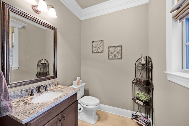 bathroom with tile patterned floors, vanity, toilet, and ornamental molding