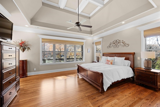 bedroom featuring light hardwood / wood-style flooring, multiple windows, and ceiling fan