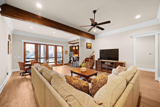 living room with ceiling fan, french doors, crown molding, and light hardwood / wood-style flooring