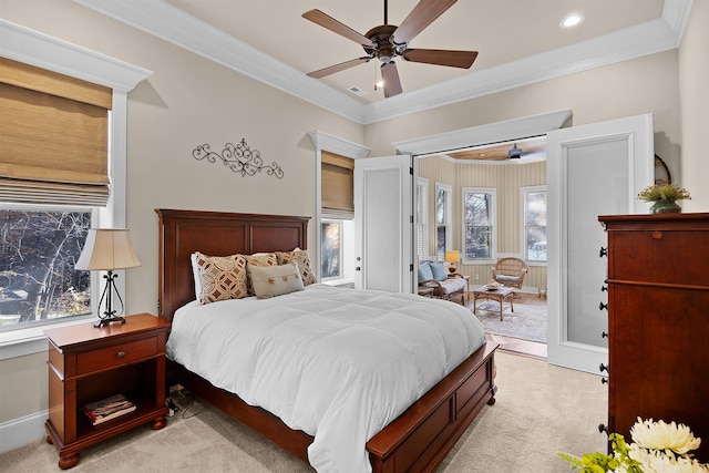 carpeted bedroom with ceiling fan and crown molding